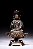 A BRONZE PARCEL GILT FIGURE OF GUANYIN