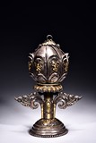A TIBETAN SILVER-GILT LOTUS MANDALA