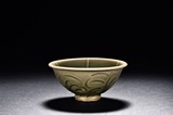 A YAOZHOU CELADON MOULDED CONICAL BOWL
