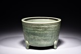 A LONGQUAN CELADON FLORAL TRIPOD CENSER