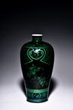 A BLACK GROUND GREEN ENAMELED 'POMEGRANATE VASE