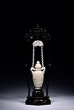 A RETICULATED WHITE JADE HANGING VASE