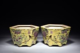A PAIR OF FAMILLE ROSE YELLOW GROUND HEXAGONAL JARDINIERES