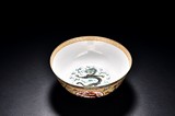 A FAMILLE ROSE 'DRAGON' AND 'BOGU' BOWL