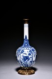 A GILT BRONZE MOUNTED CHINESE BLUE AND WHITE VASE