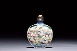 A PORCELAIN 'FIGURES' SNUFF BOTTLE