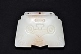 A SMALL WHITE JADE PLAQUE