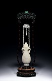 A WHITE JADE CARVED HANGING VASE