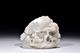 A WHITE JADE 'HORSE TAMER BOLE' BOULDER