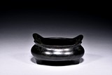 A BRONZE TRIPOD CENSER