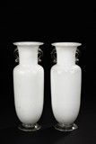 A PAIR OF WHITE GLASS ROULEAU BOTTLES