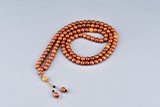 AN AMBER NECKLACE OF 103 BEADS 
