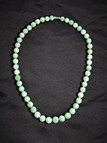 A JADEITE BEAD NECKLACE