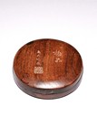 A CIRCULAR DUAN STONE INK STONE AND BOX