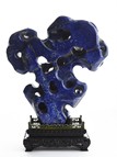 A LAPIS LAZULI ROCKWORK WITH ZITAN STAND