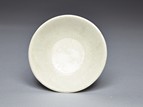 A WHITE GLAZED DISH