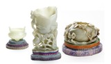 A GROUP OF THREE WHITE AND CELADON JADE VESSELS