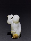 A WHITE JADE 'LIUHAI AND GOLDEN TOAD' CARVING