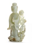 A WHITE JADE CARVED FIGURE