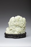 A WHITE JADE CARVED MOUNTAIN BOULDER