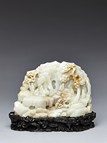 A WHITE JADE ‘NINE ELDERS OF XIANGSHAN' BOULDER 