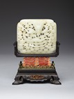 A WHITE JADE 'DRAGON' SCREEN PANEL WITH ZITAN STAND 