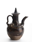 A BLACK GLAZED EWER