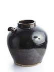 A BLACK GLAZED EWER