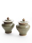 A PAIR OF LONGQUAN CELADON JARDINIERES WITH COVER