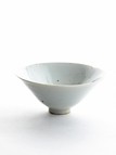A WHITE GLAZED CONICAL BOWL