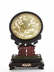 A WHITE JADE 'DRAGON' CIRCULAR SCREEN PANEL W/ ZITAN STAND 