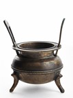 A BRONZE TWO-HANDLED TRIPOD CENSER 