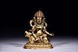 A GILT BRONZE FIGURE OF TIBETAN GUARDIAN