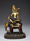 A GILT-BRONZE FIGURE OF SAMANTABHADRA