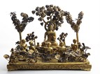 A GILT BRONZE STATUE OF SHAKYAMUNI TEACHING UNDER BODHI TREE