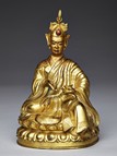A GILT-BRONZE FIGURE OF PADMASAMBHAVA
