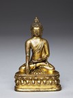 A GILT-BRONZE FIGURE OF SHAKYAMUNI 