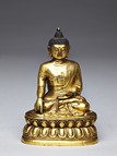 A GILT-BRONZE FIGURE OF SHAKAYMUNI
