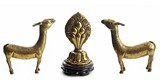A PAIR OF TIBETAN GILT-BRONZE DEER AND WHEEL OF DHARMA