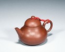A YIXING ZISHA 'PEAR-SHAPED' TEAPOT