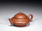 A COMPRESSED GLOBULAR ZISHA TEAPOT