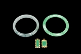 A PAIR OF JADEITE BANGLES AND PENDANTS