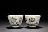 A PAIR OF FAMILLE ROSE 'NINE PEACHES' CUPS