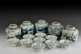 A SET OF PROVINCIAL KILN UNDERGLAZED BLUE AND WHITE BOWLS AND FLASKS
