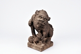 A STONE CARVED BUDDHIST LION