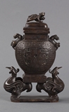 A BRONZE DECORATED COVERDED VESSEL