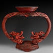 A LACQUER WOOD CARVED DRAGONS STAND