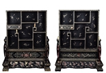 A PAIR OF GILT-PAINTED BLACK LACQUER TABLE SCREEN CABINETS