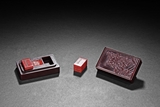 A SET OF RED SHOUSHAN SEALS AND BOX