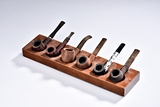 A GROUP OF SIX SMOKING PIPES